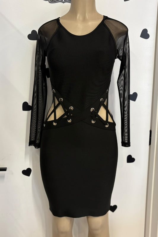 Black dress with sheer sleeves on a mannequin against a white background