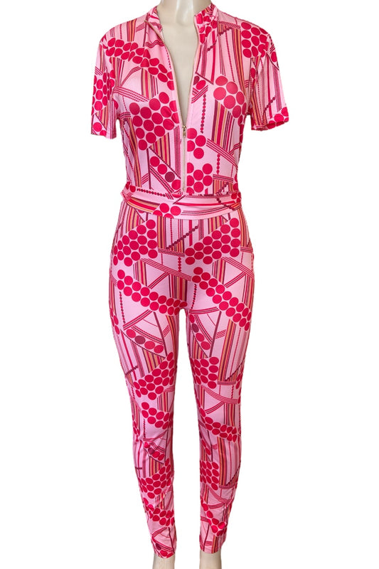 Pink patterned jumpsuit on a mannequin against a white background