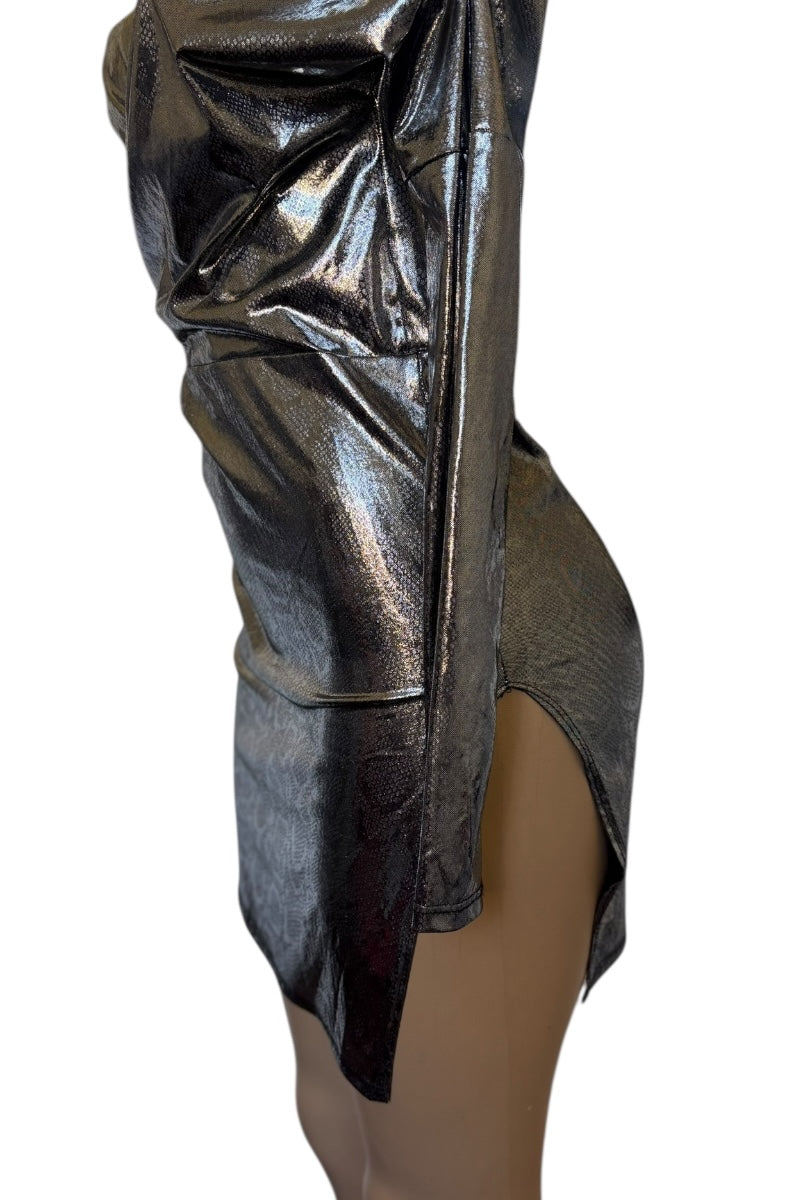 Metallic silver dress with a high slit on a white background