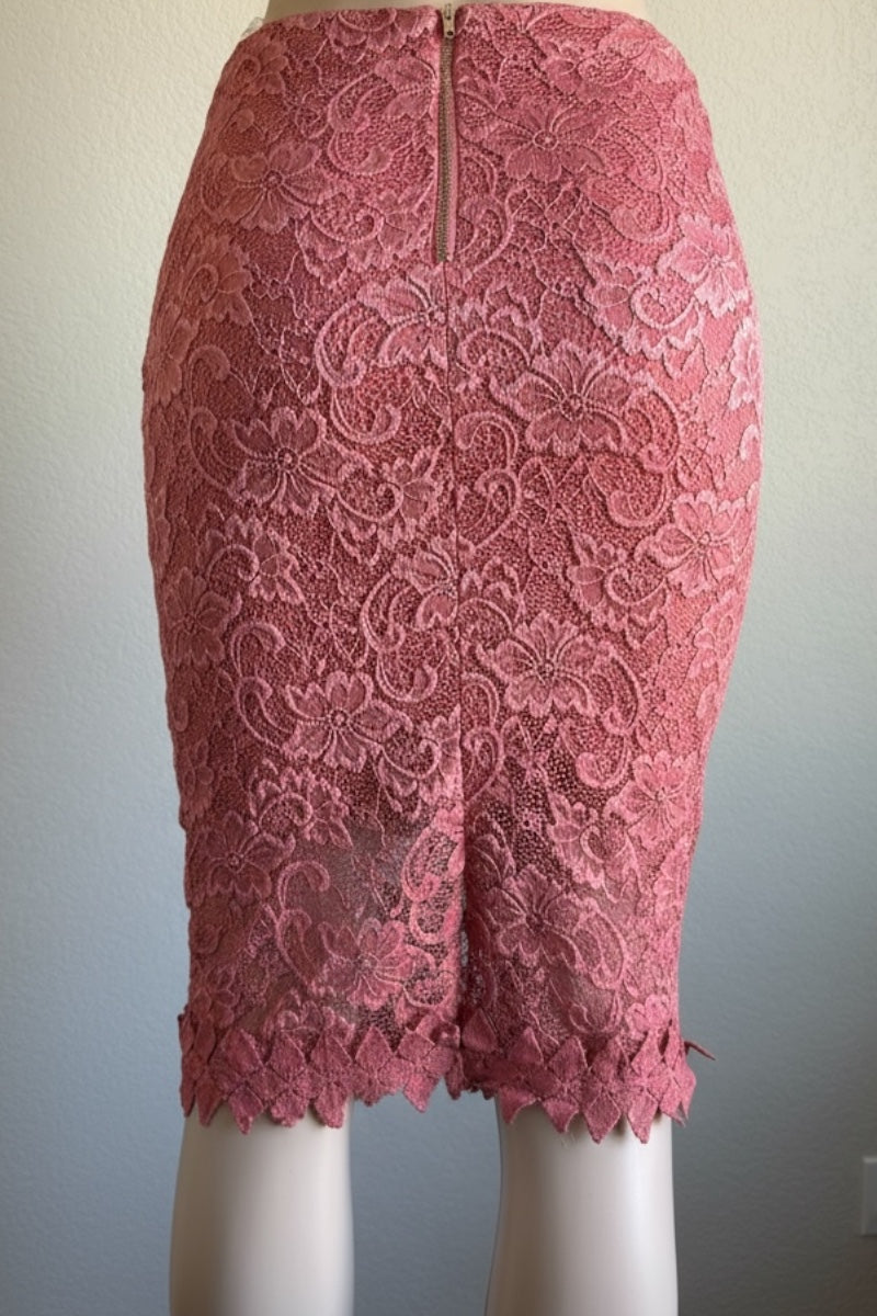 Pink lace pencil skirt on a mannequin against a plain background