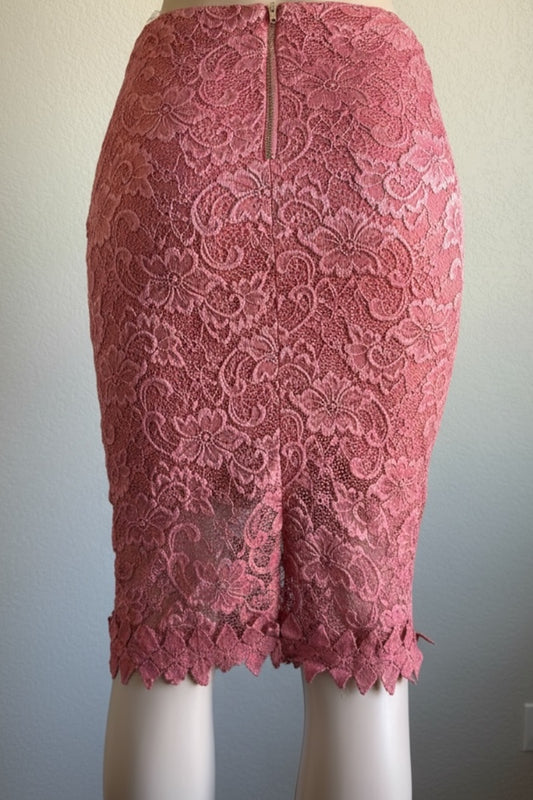 Pink lace pencil skirt on a mannequin against a plain background