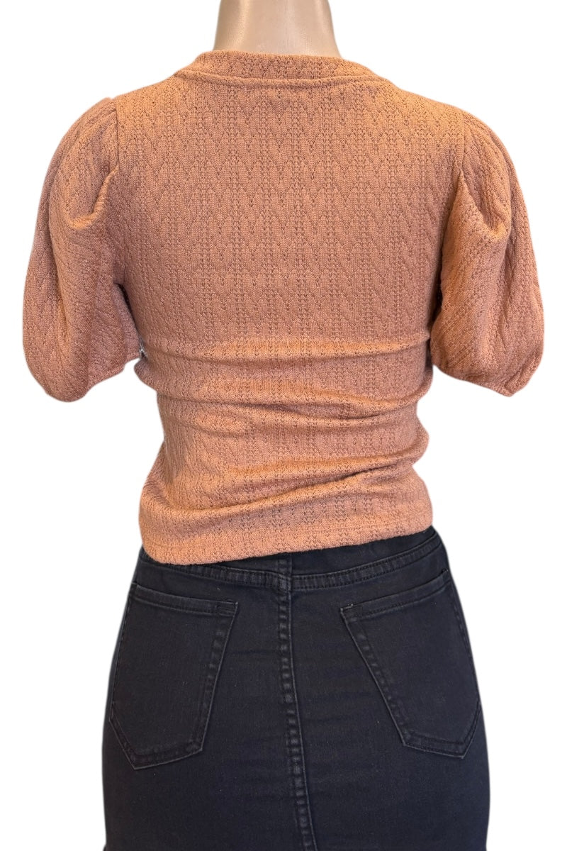 tan textured top on a mannequin with a white background