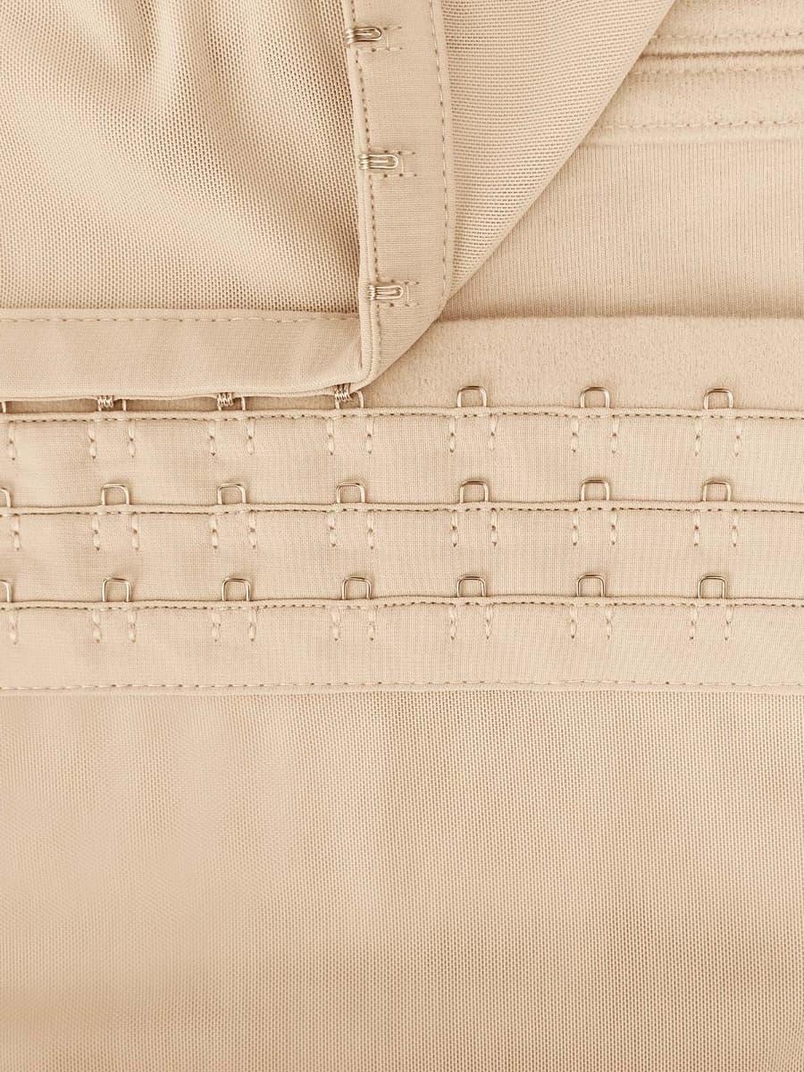 Close-up of beige fabric with stitching details