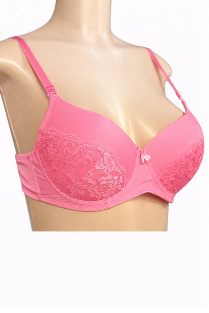 Pink bra with lace details on a mannequin against a white background