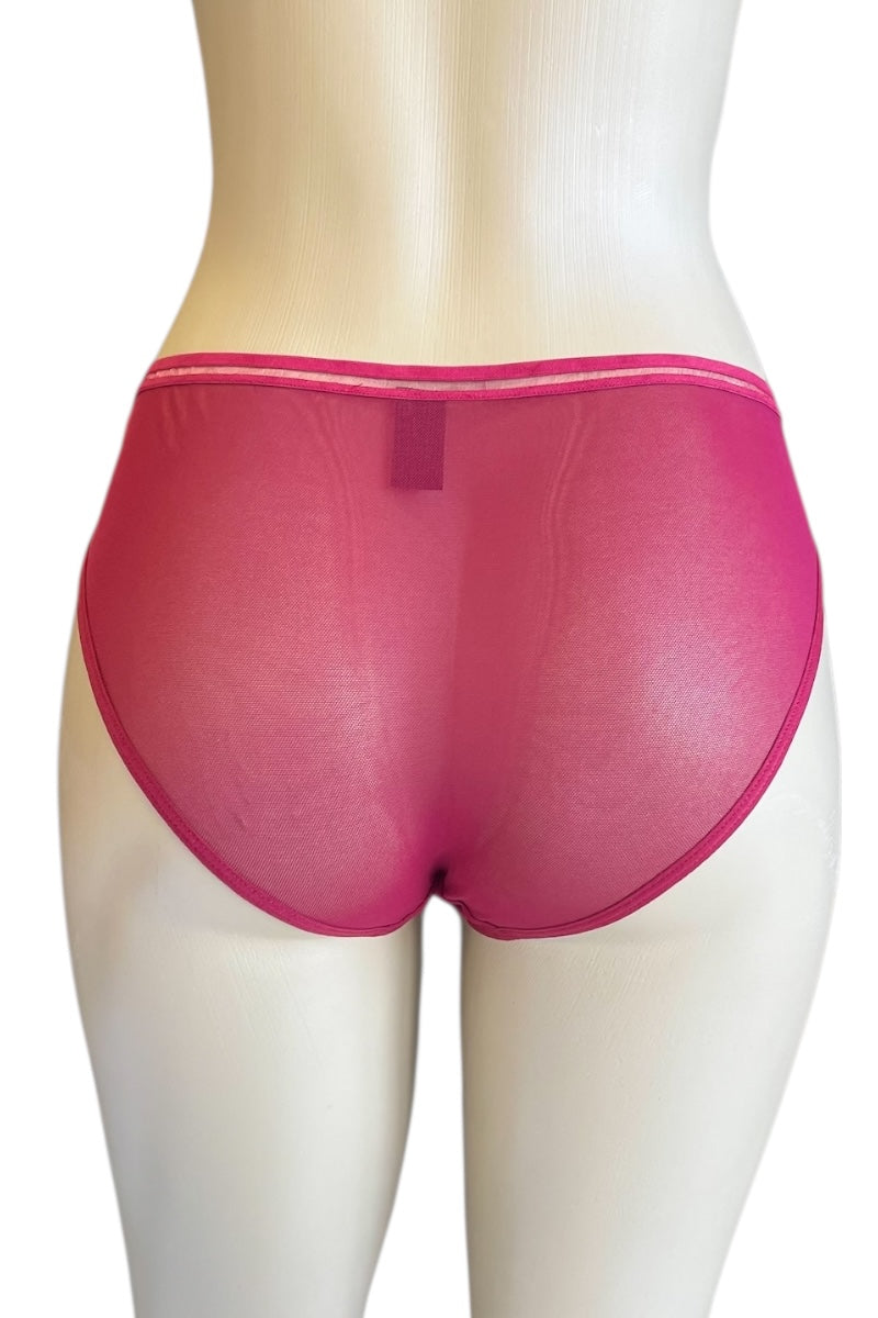 Red underwear on a mannequin against a white background