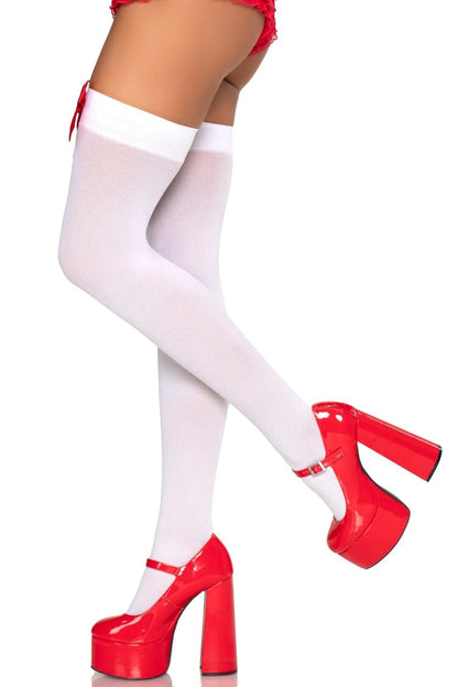 White thigh-high stockings with red platform shoes on a white background