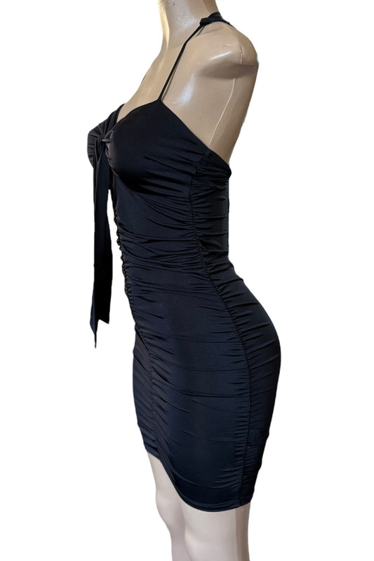 Black dress on a mannequin against a white background