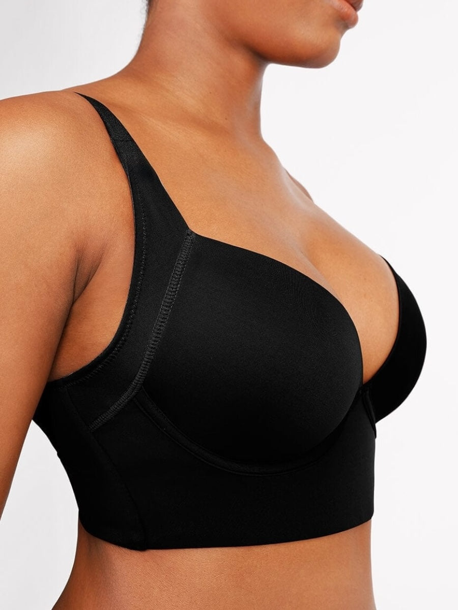 Black bra worn by a person on a plain background
