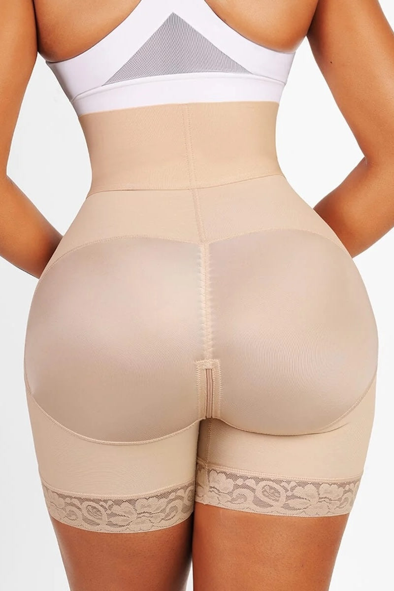 Beige shapewear with lace details on a plain background