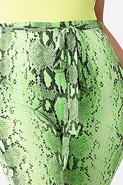 Green snake print skirt with a close-up view