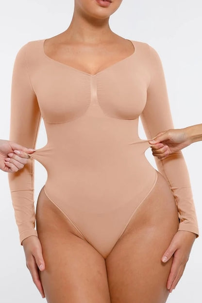Beige bodysuit being modeled on a plain background