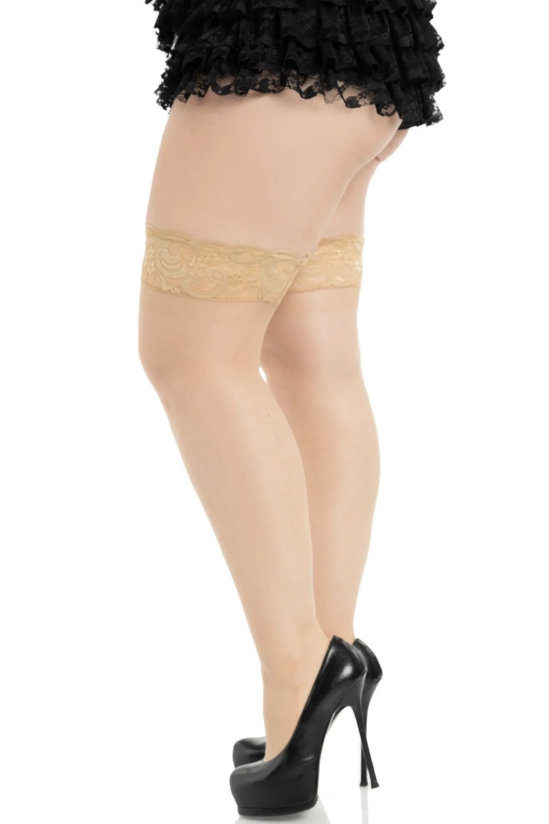 Beige lace garter belt worn with black stockings and high heels on a white background