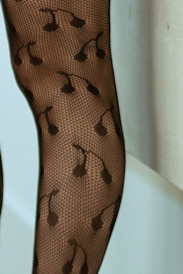 black fishnet stocking with black cherry pattern on a white background