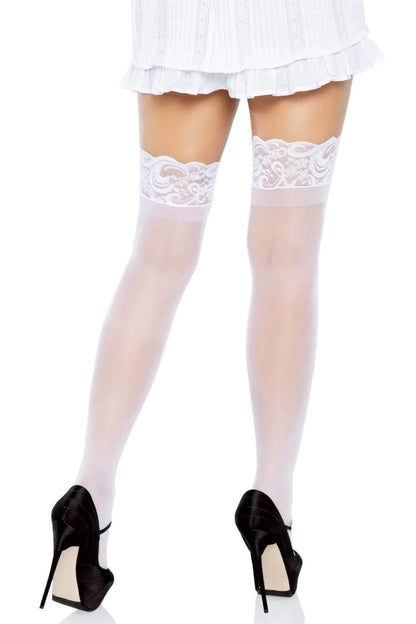 White lace stockings worn with black high heels on a white background