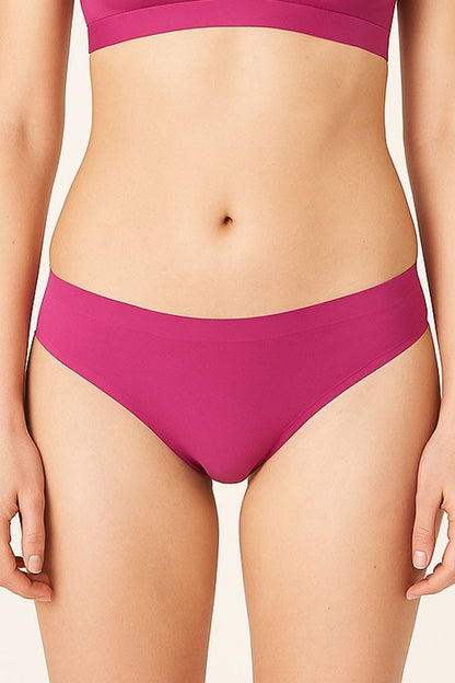 Person wearing a fuchsia bikini set on a plain background