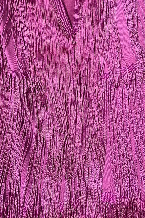 Close-up of a purple textured fabric with fringes