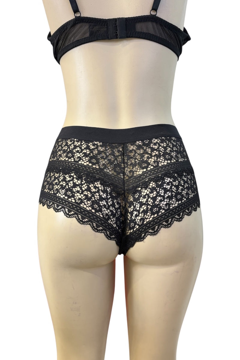 Black lace and mesh lingerie set displayed on a mannequin, featuring a high-waisted brief with floral lace and a matching sheer mesh bralette.