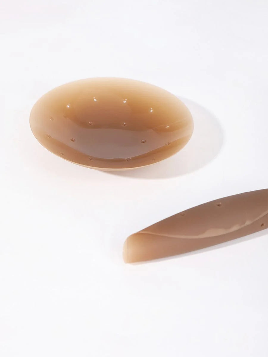 Brown nipple covers on a white background