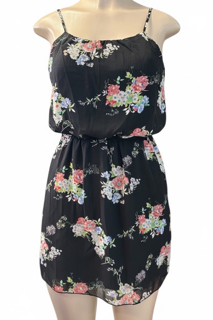 Black floral dress on a mannequin against a white background
