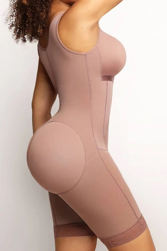 Person wearing a cocoa shapewear garment on a plain background
