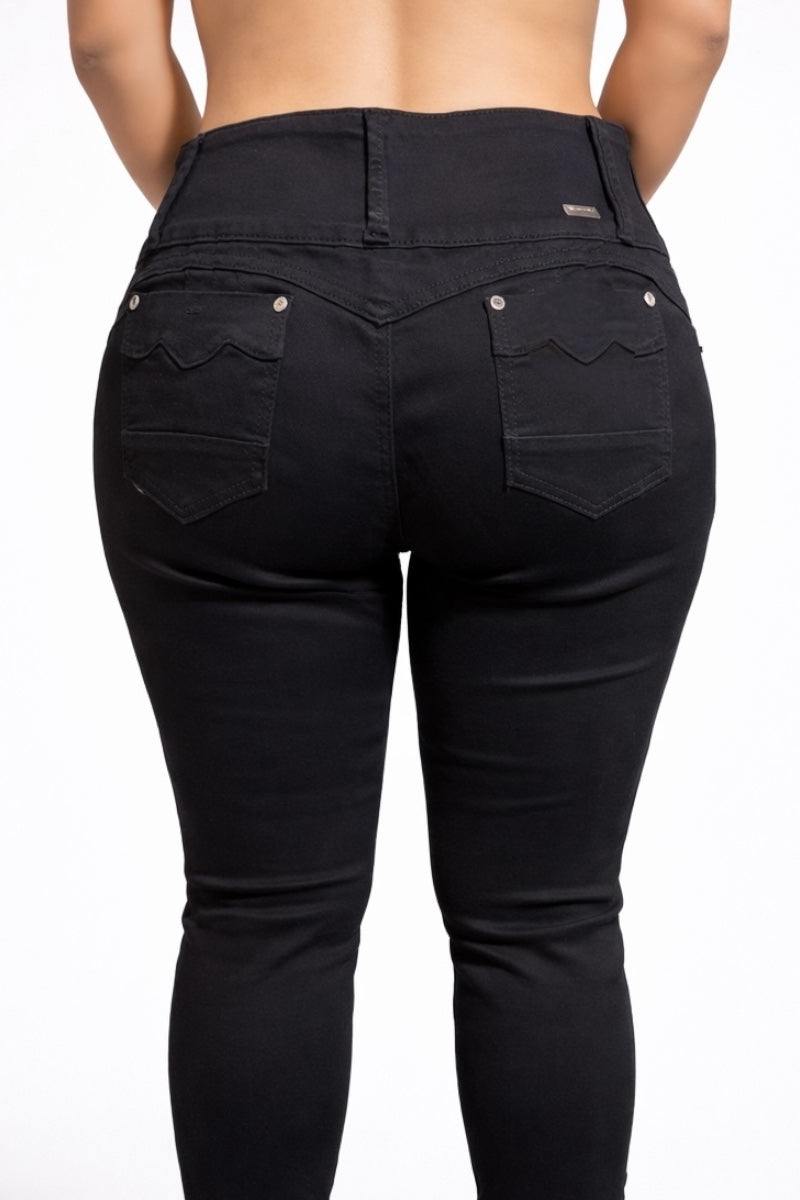 Black jeans worn by a person on a white background