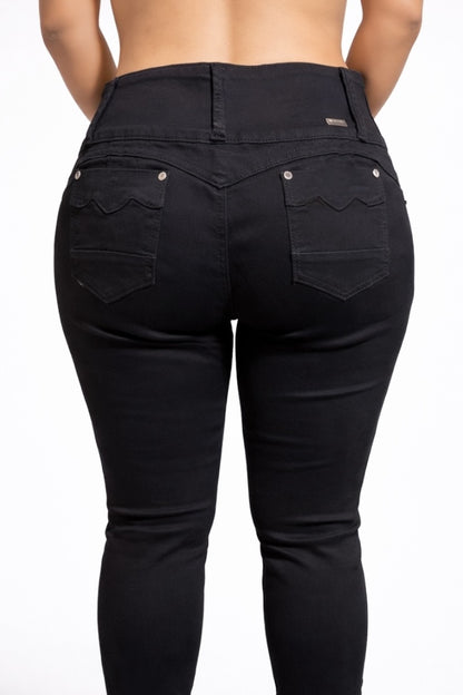 Black jeans worn by a person on a white background