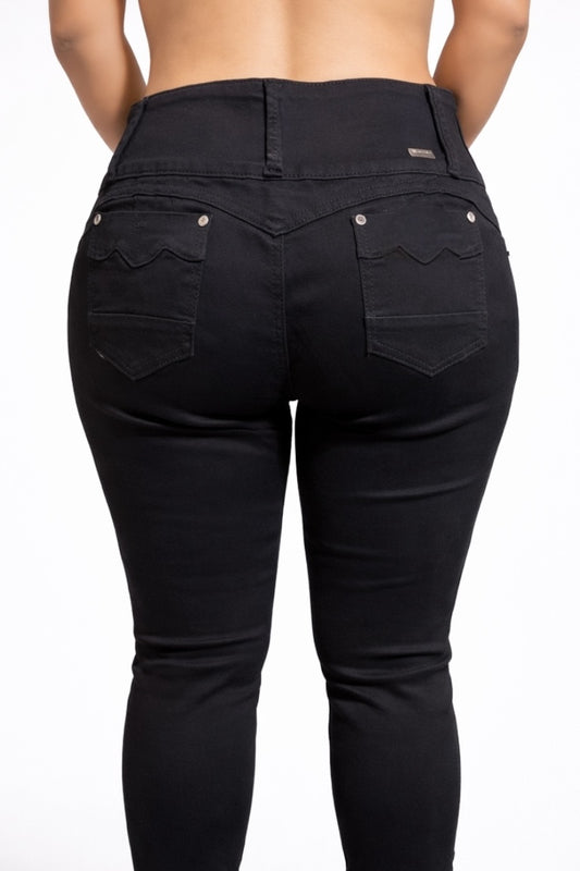 Black jeans worn by a person on a white background
