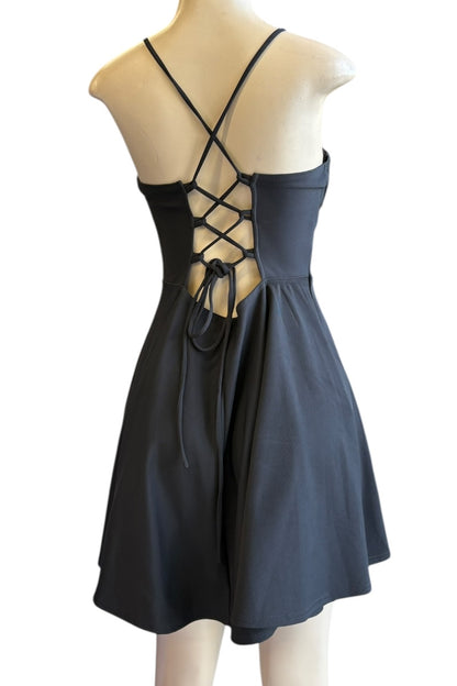 Black dress with criss-cross back on a mannequin against a white background