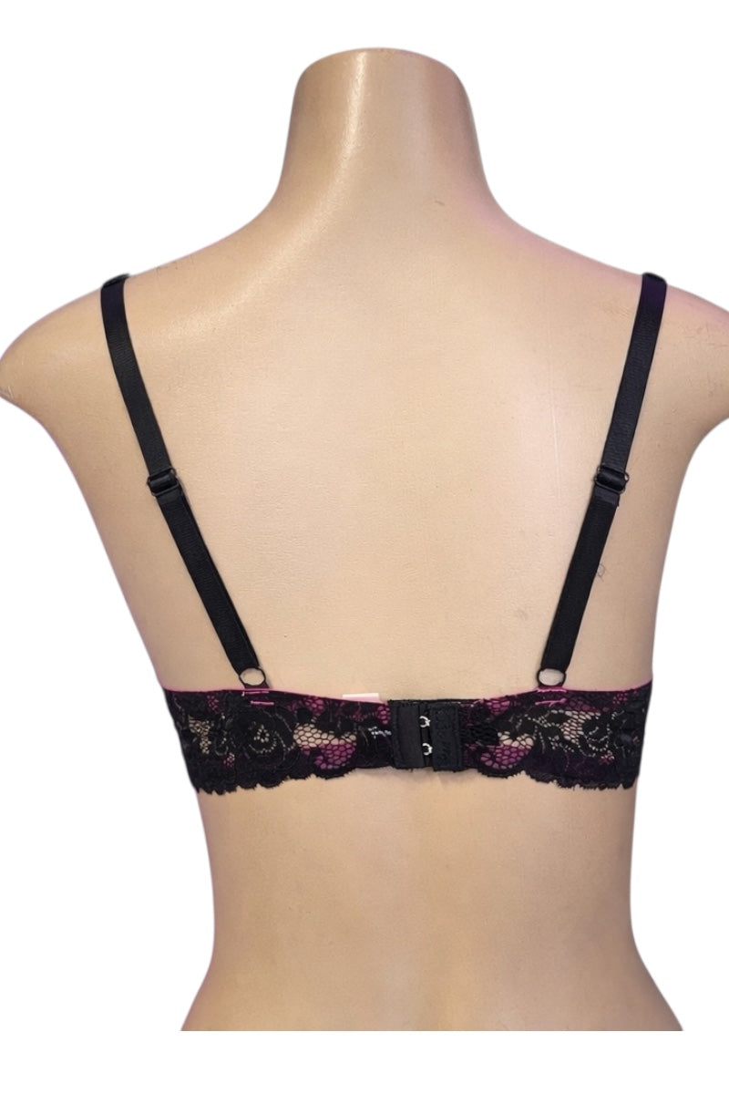 Black lace bra on a mannequin with a white background
