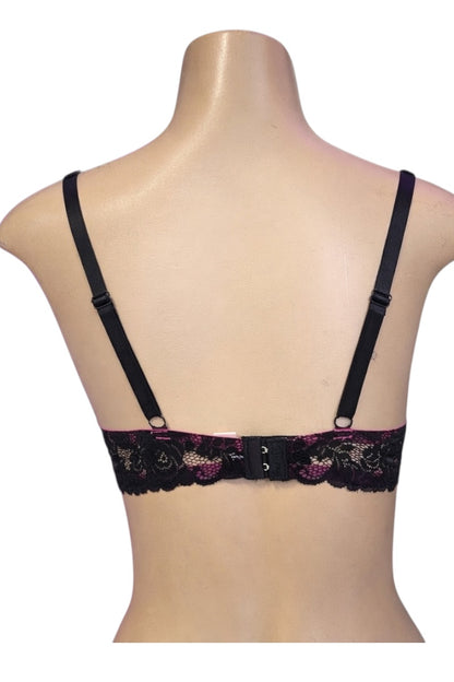 Black lace bra on a mannequin with a white background