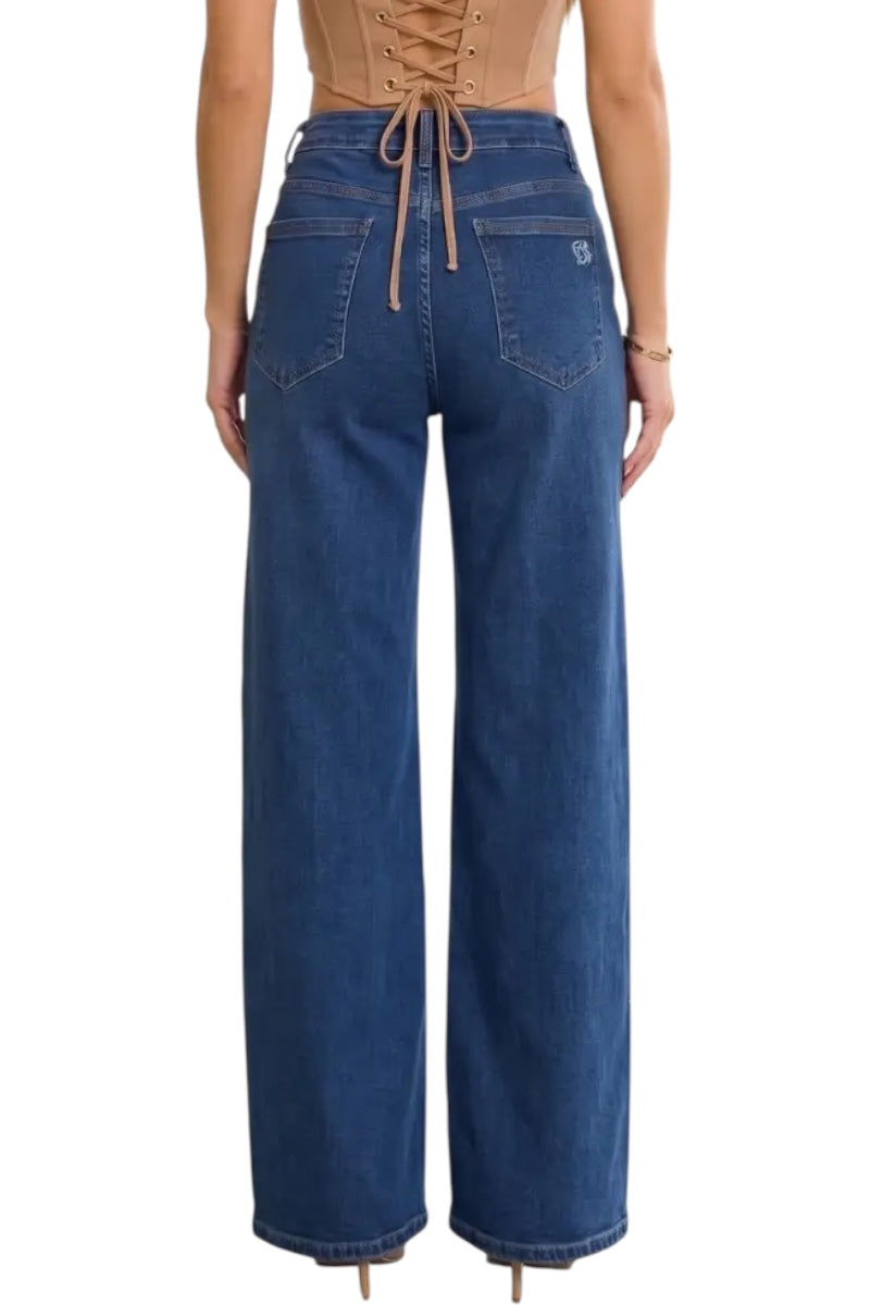 A model shown from the back wearing high-waisted, wide-leg blue jeans with a drawstring waistband and a small silver logo on the back pocket.