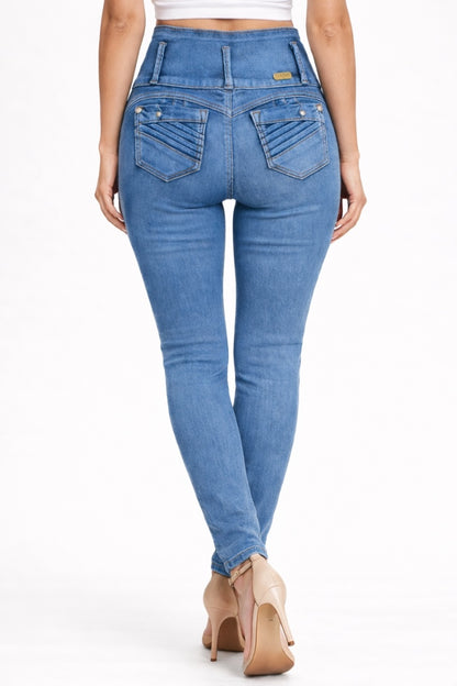 Blue jeans worn by a person on a white background