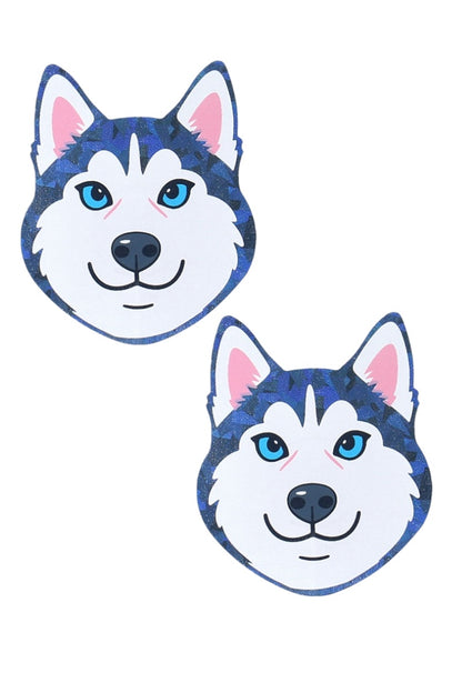 Two cartoon-style dog face pasties with blue and white fur on a white background