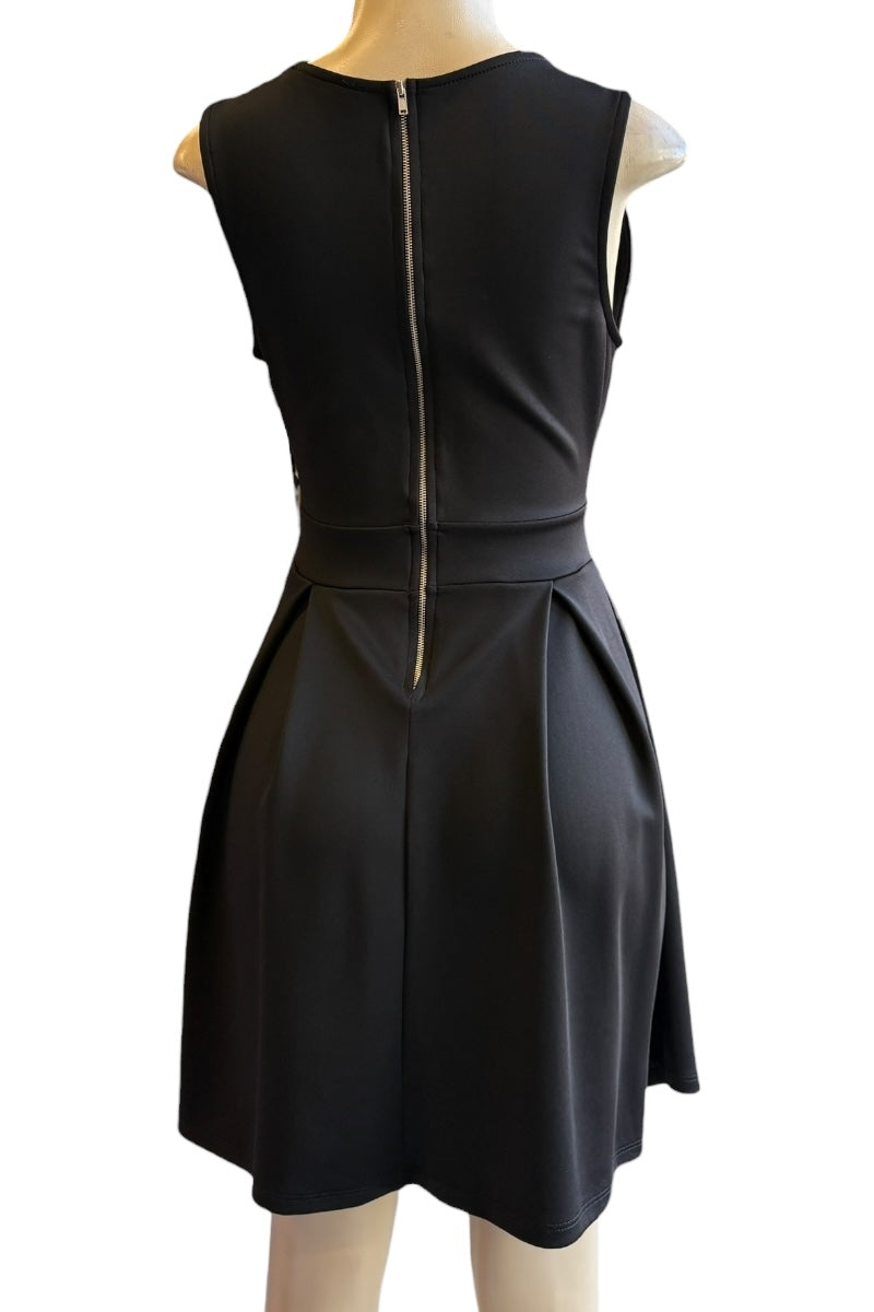 Black sleeveless dress with a zipper on a mannequin against a white background