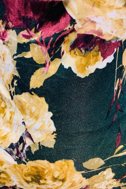 Close-up of a floral pattern with yellow and red flowers on a dark background