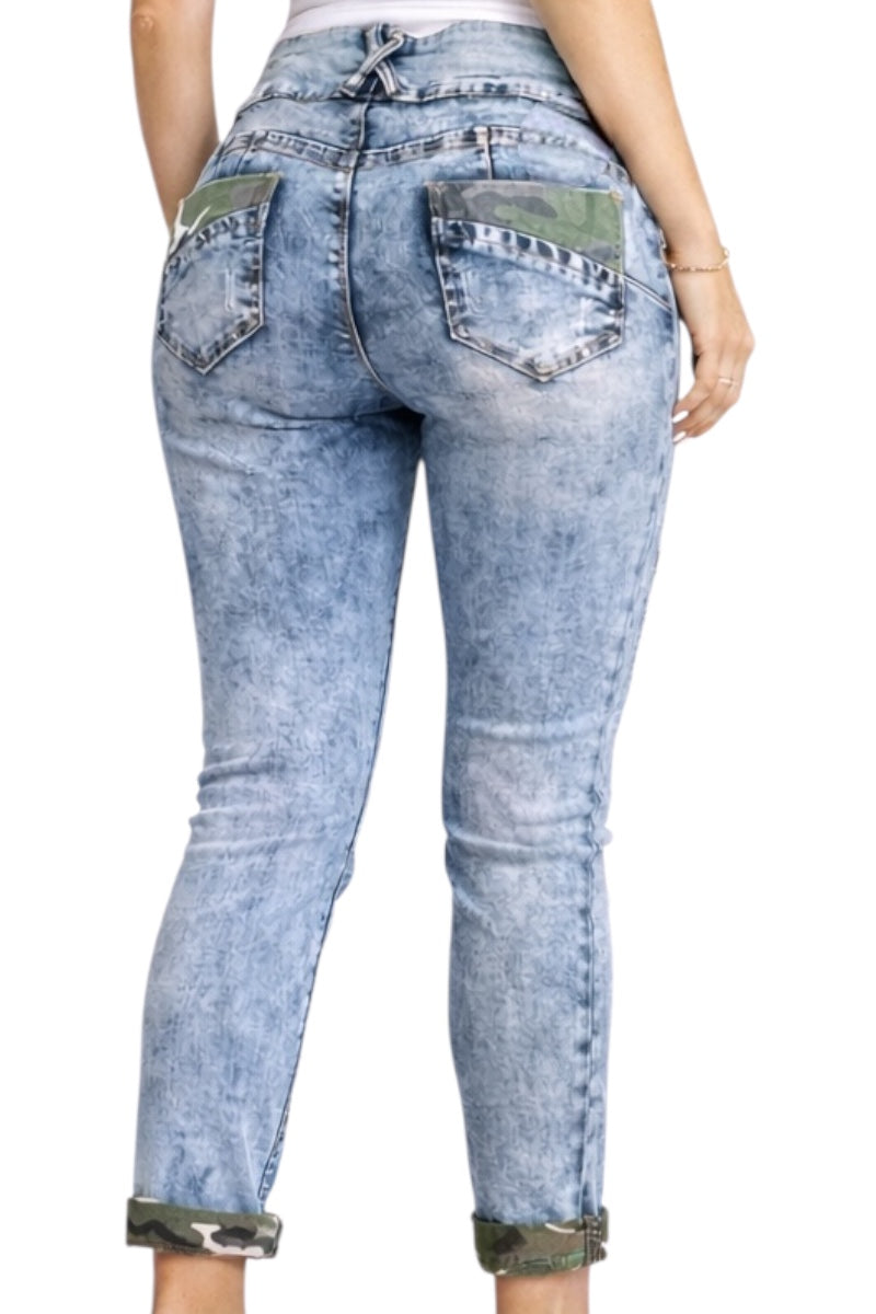 Light blue jeans with camouflage accents on a white background