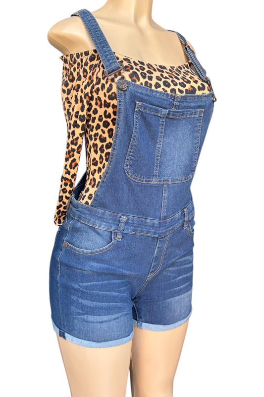 Blue denim overalls worn by a mannequin with a leopard print top.