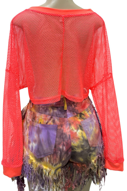 Mannequin wearing an orange mesh top and colorful tie-dye shorts on a white background