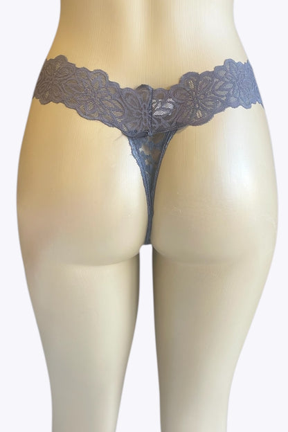 Lace thong worn by a mannequin on a white background