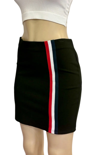 A black bodycon mini skirt with a vertical red, white, and navy blue stripe down the front side, shown on a mannequin torso with a white ribbed crop top against a white background.