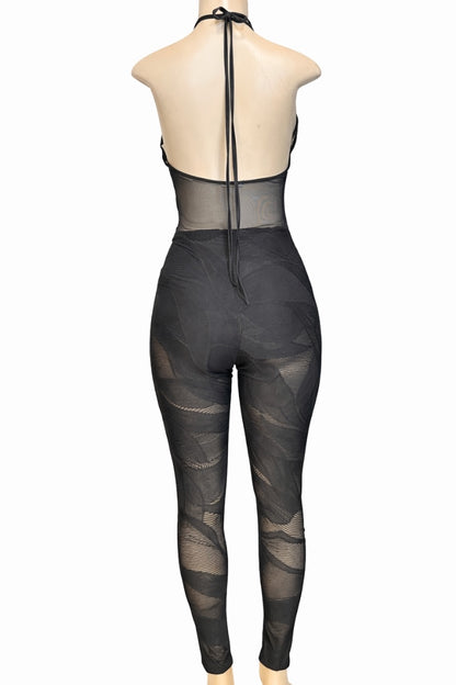 Black sheer jumpsuit on a mannequin against a white background