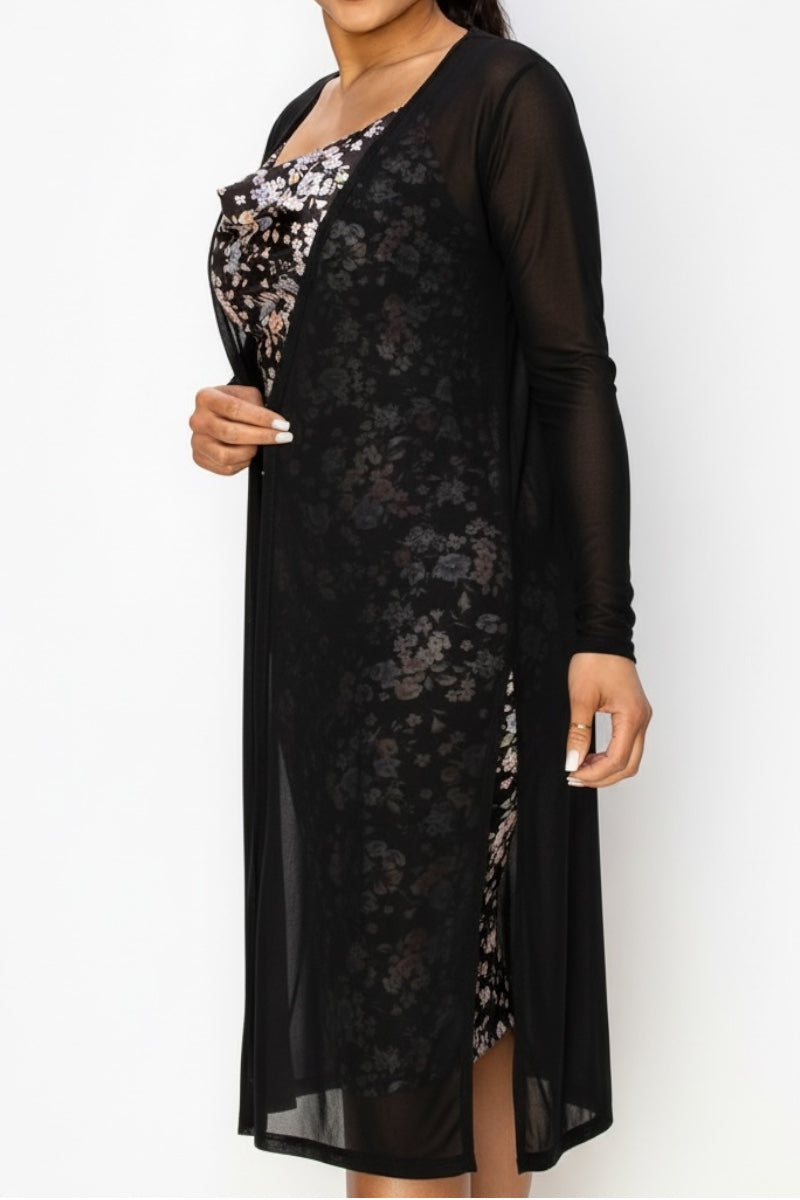 Black sheer overlay cardigan over a floral dress on a model on a white background
