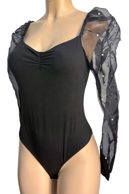 Black bodysuit with sheer sleeves on a mannequin against a white background
