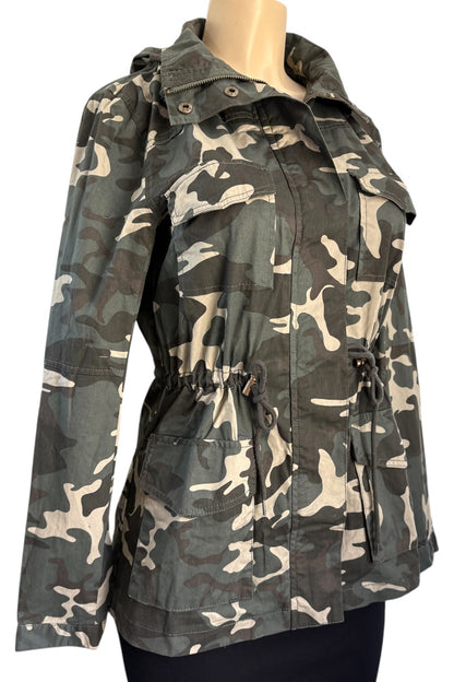 Camouflage jacket on a mannequin against a white background