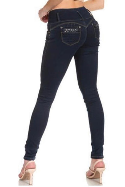 Navy blue jeans worn by a person on a white background