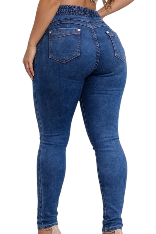 Blue jeans being worn on a white background