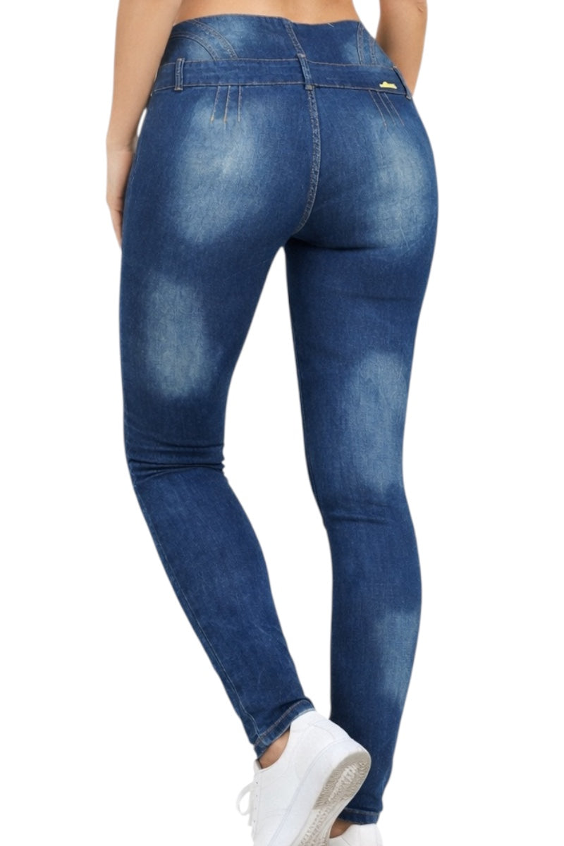 Blue jeans worn by a person on a white background