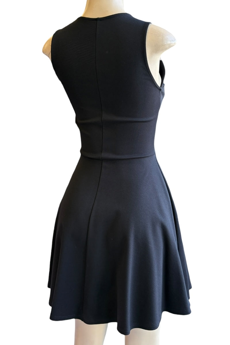 Black dress on a mannequin against a white background