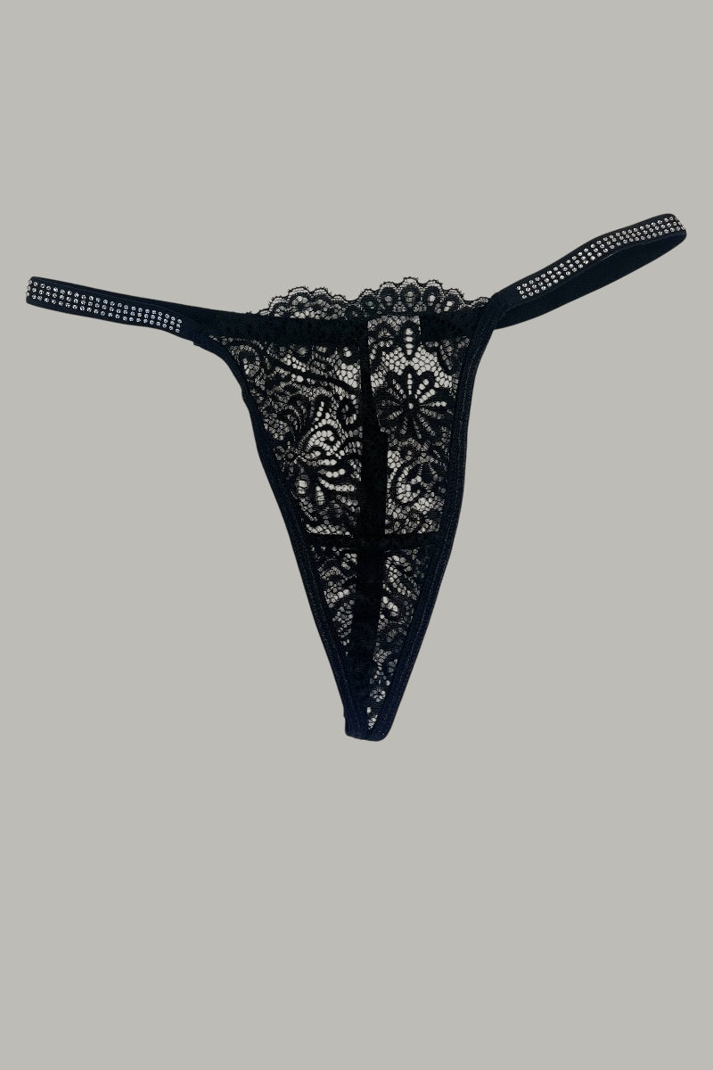 Black lace thong on a gray background