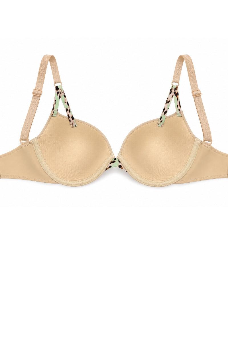 A beige underwire bra with patterned shoulder straps featuring green, black, and white details, shown against a plain white background.